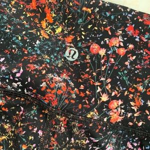 Floral on black Lululemon leggings sz 12 like new